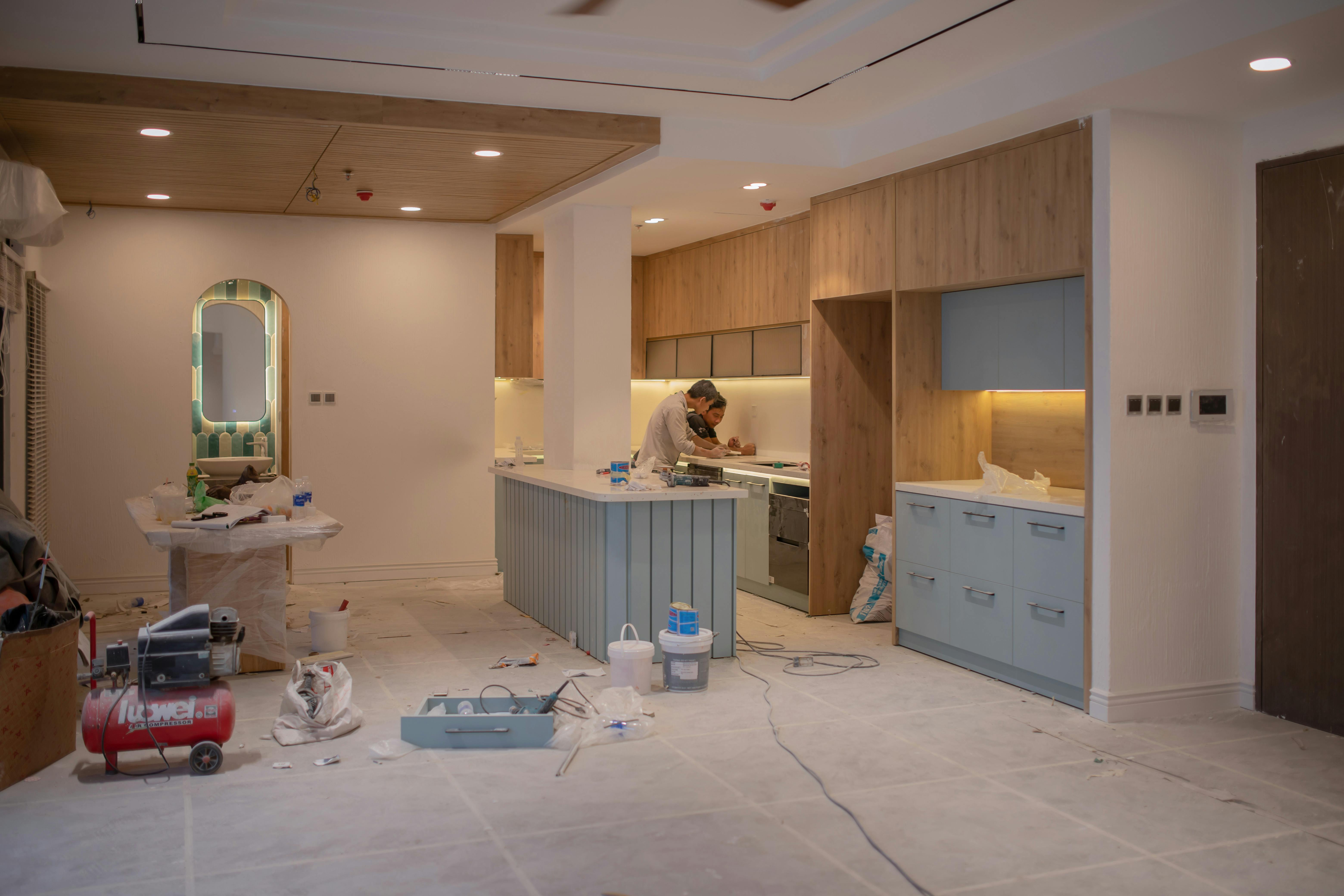 Modern kitchen renovation in Toronto with white cabinets and quartz countertops