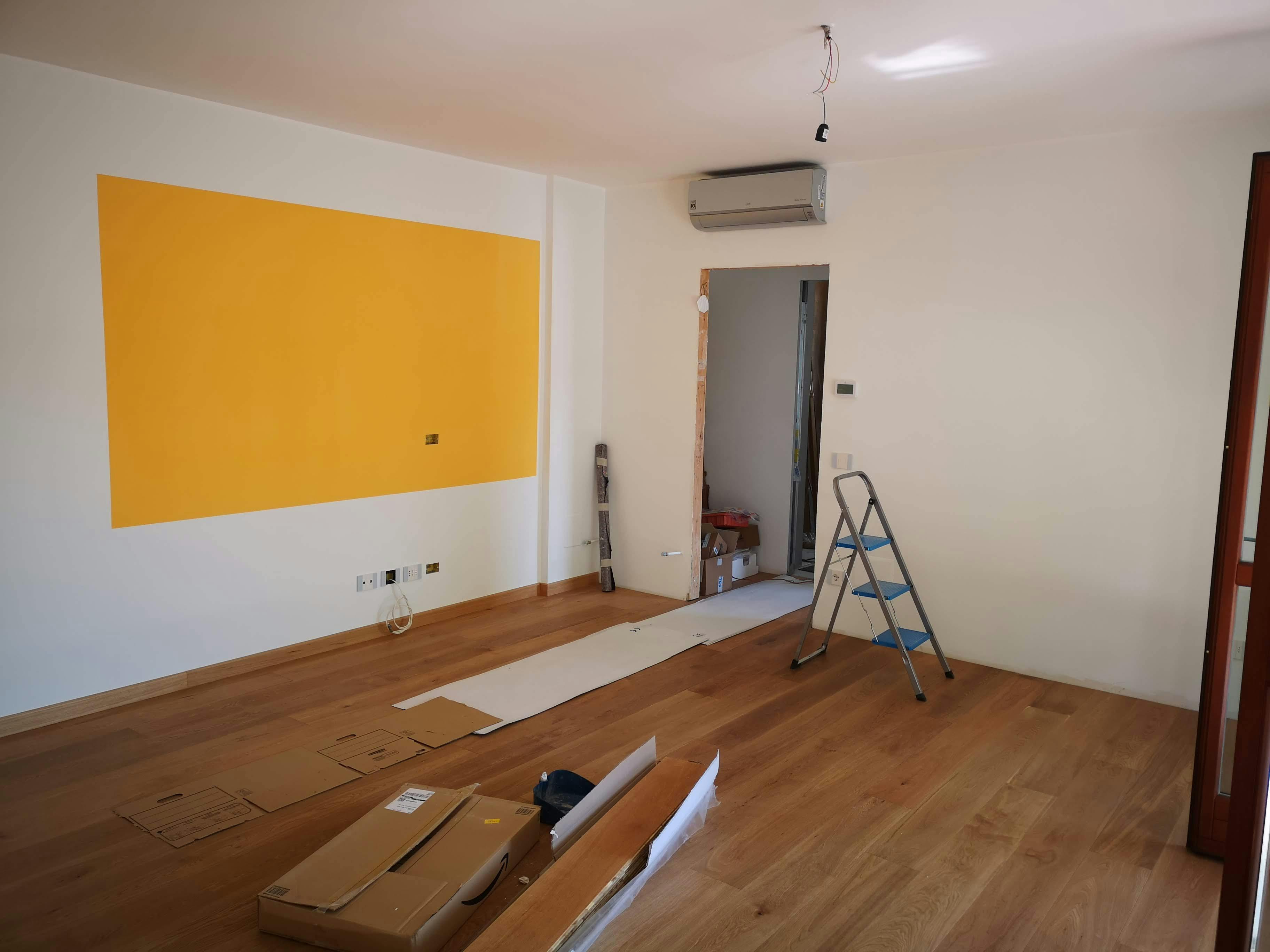 Finished basement family room Toronto with laminate flooring built-in entertainment center and recessed lighting